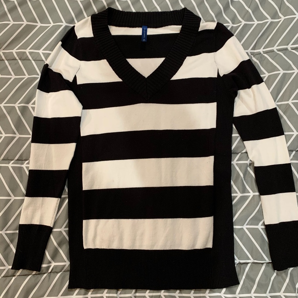 Black and white striped v-neck sweater.